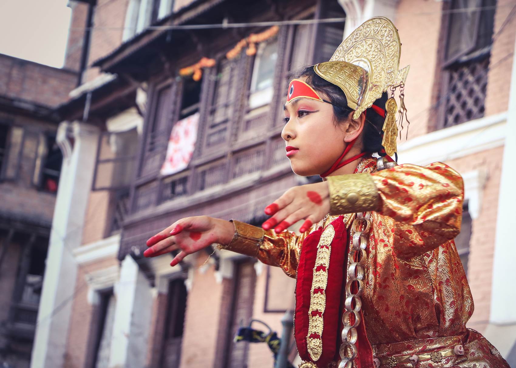 woman-wearing-yellow-and-red-traditional-dress-dancing-near-1274922.jpg